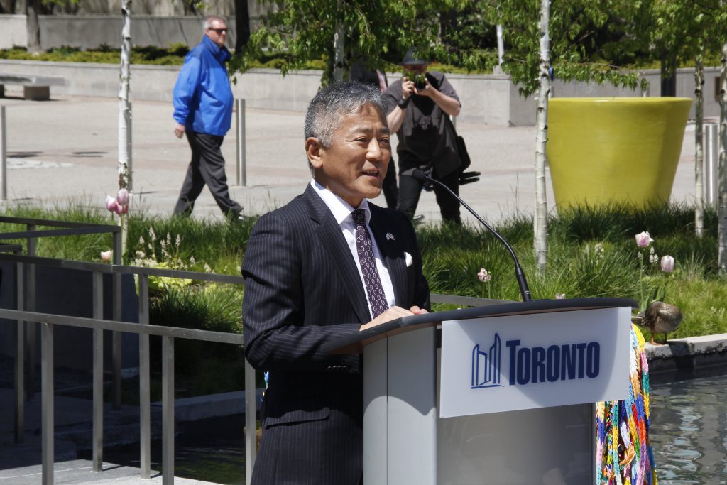 Consul General of Japan, Yasunori Nakayama, the chair of the Toronto Interfaith Council, Zul Kassamali, Toronto Poet Laureate Anne Michaels, Phyllis Creighton of the Hiroshima Nagasaki Day Coalition, and the Jarvis Collegiate Institute Choir. Rededication photos by Michael Chambers.

