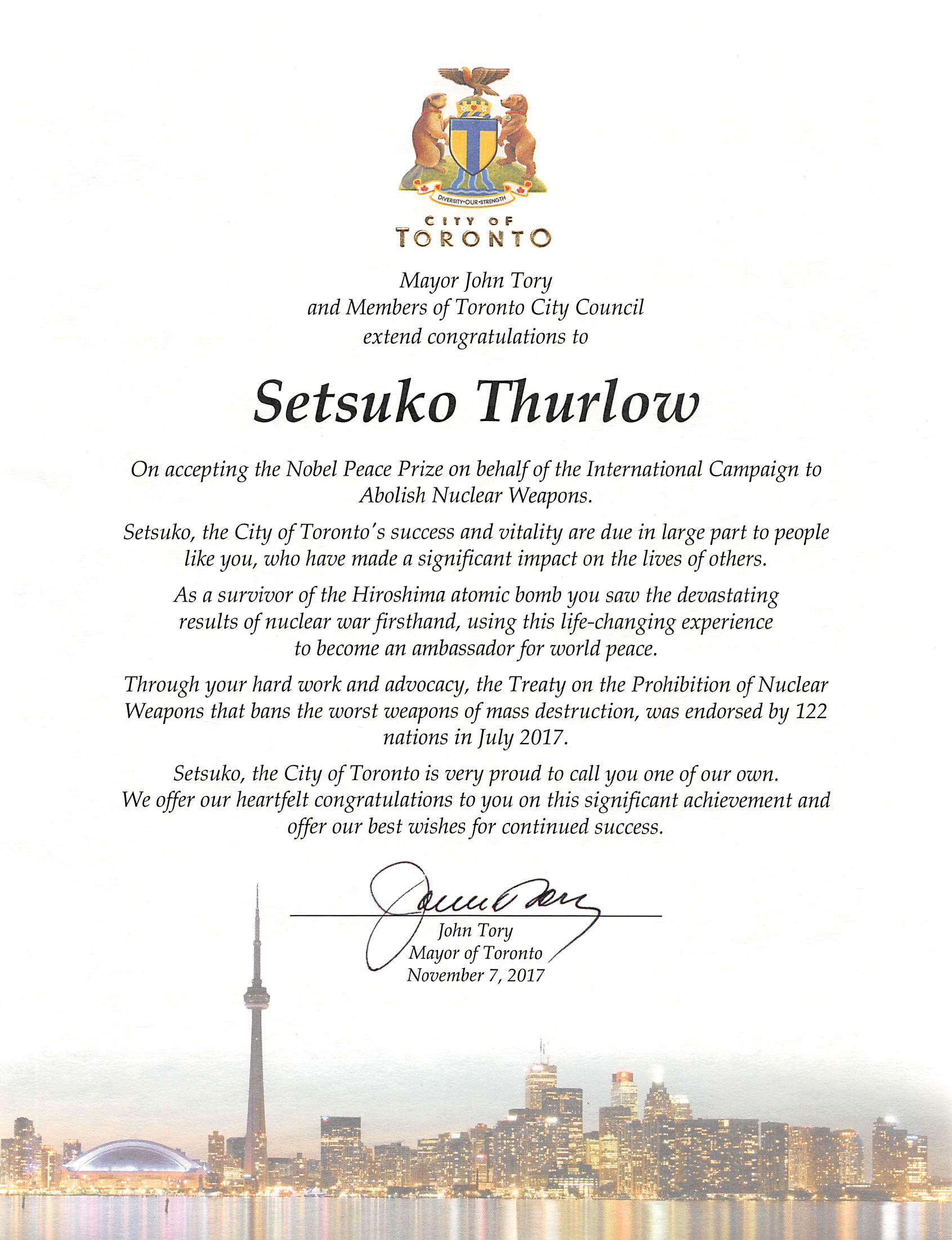 Mayor Tory presented Thurlow with a framed scroll. It stated in part that “as a survivor of the Hiroshima atomic bomb, you saw the devastating results of nuclear war firsthand, using this life-changing experience to become an ambassador for world peace.”